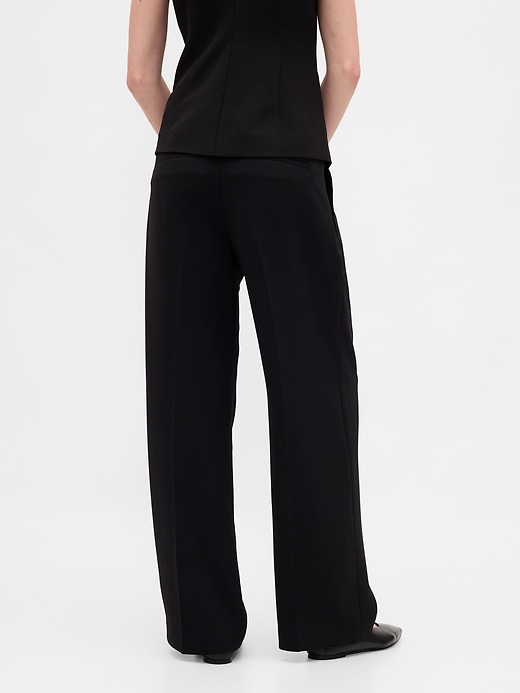 pantalon 365 à jambes larges plissées et taille basse