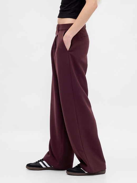 pantalon 365 à jambes larges plissées et taille basse