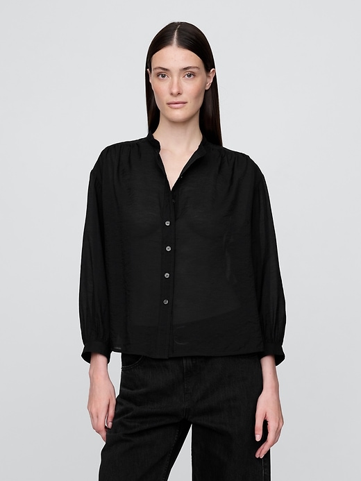 chemise transparente à boutons sur le devant