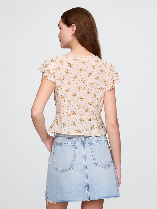 haut fleuri à bordure en dentelle