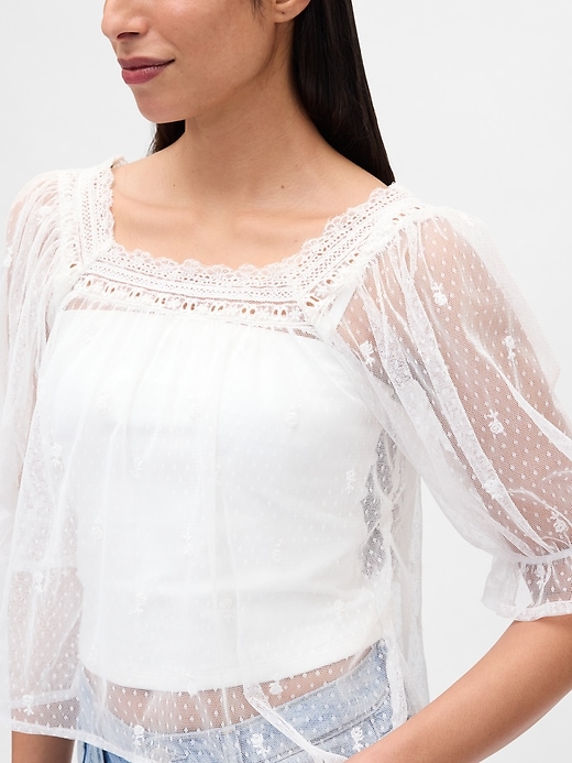 haut en tulle transparent brodé