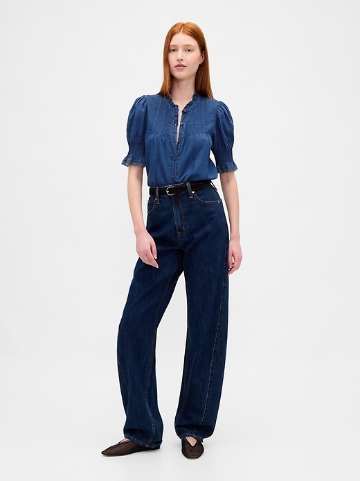 chemise à volants et plis piqués