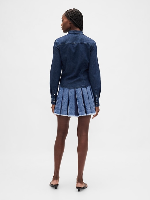 mini-jupe plissée en jean