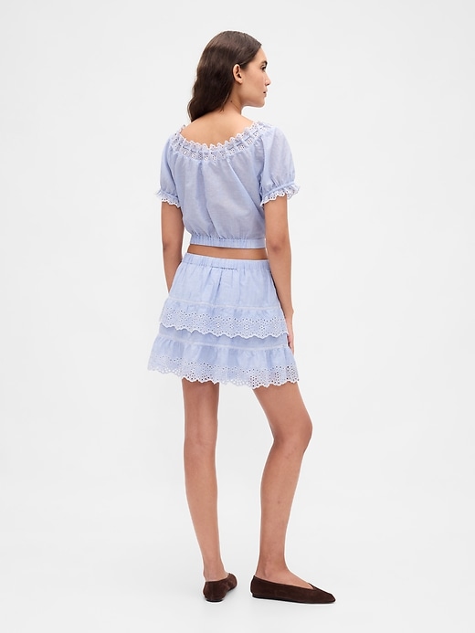 jupe-short mini à œillets et volants