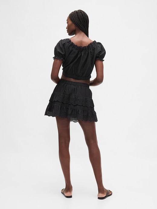 jupe-short mini à œillets et volants