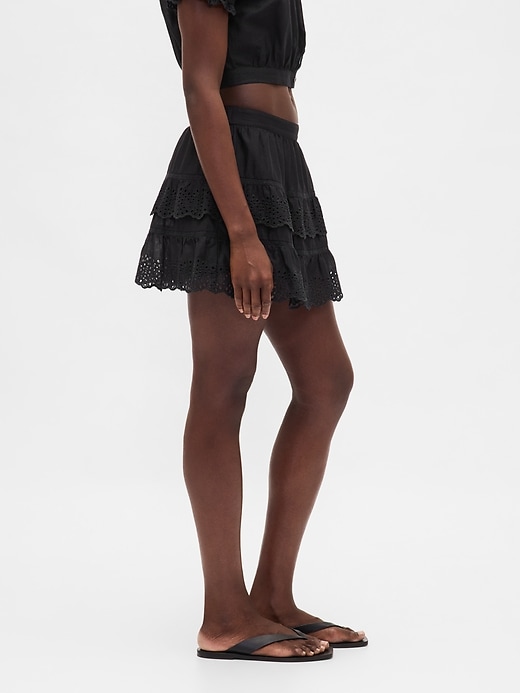 jupe-short mini à œillets et volants