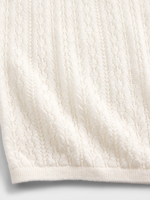 pull à col roulé en maille ajourée