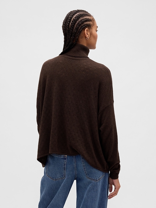 col roulé oversize en maille ajourée