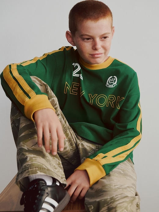 t-shirt avec logo de maillot de football pour enfants